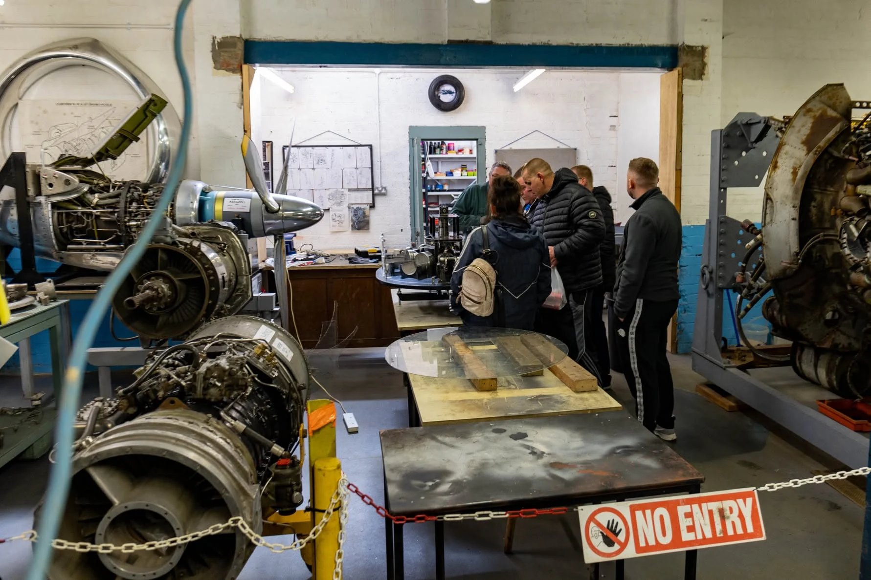 Participants viewing historic aircraft engines at the Ulster Aviation Society
