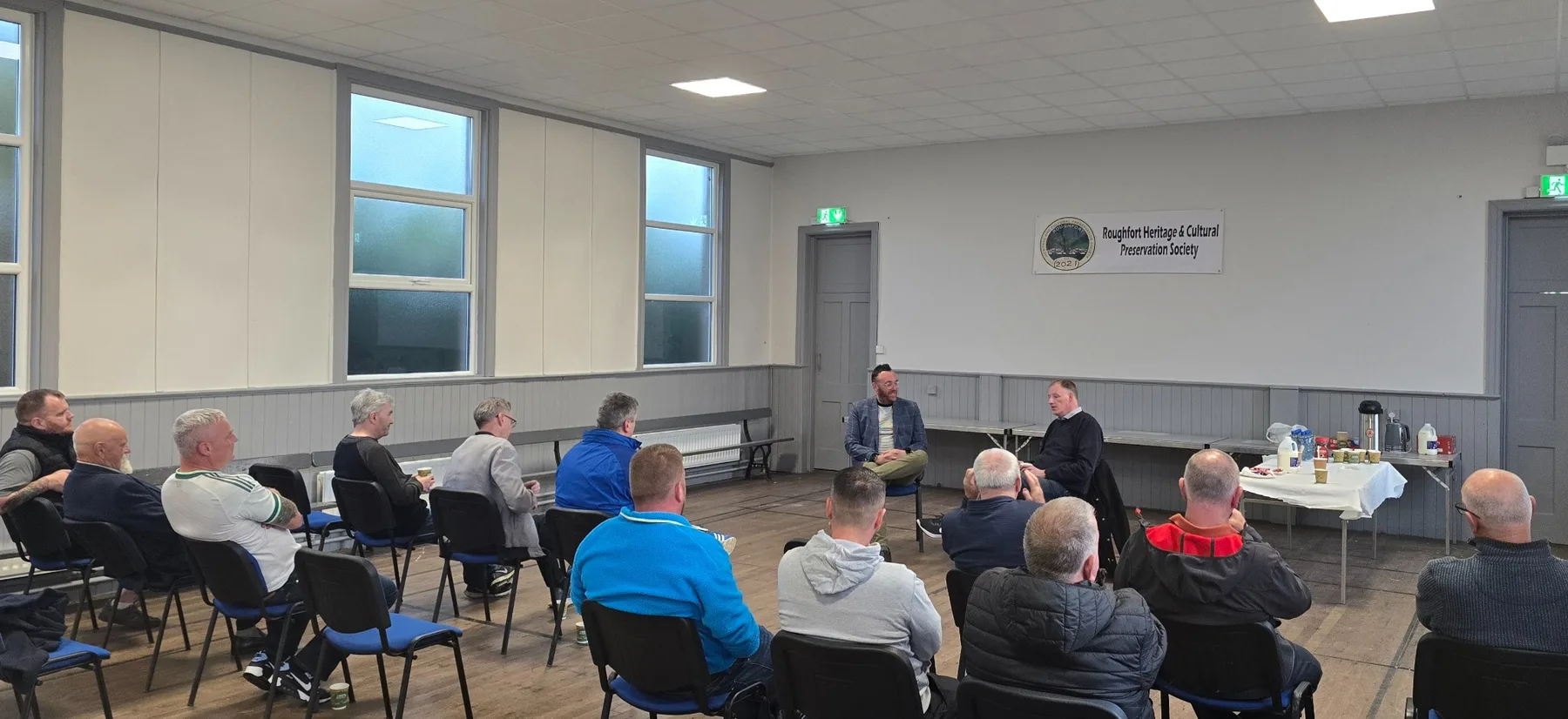 Michael Boyd OBE speaking with attendees at Hydepark War Memorial Orange Hall during the opening mental health and well-being talk